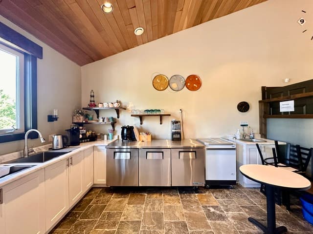 Service kitchen and beverage area with wood ceiling